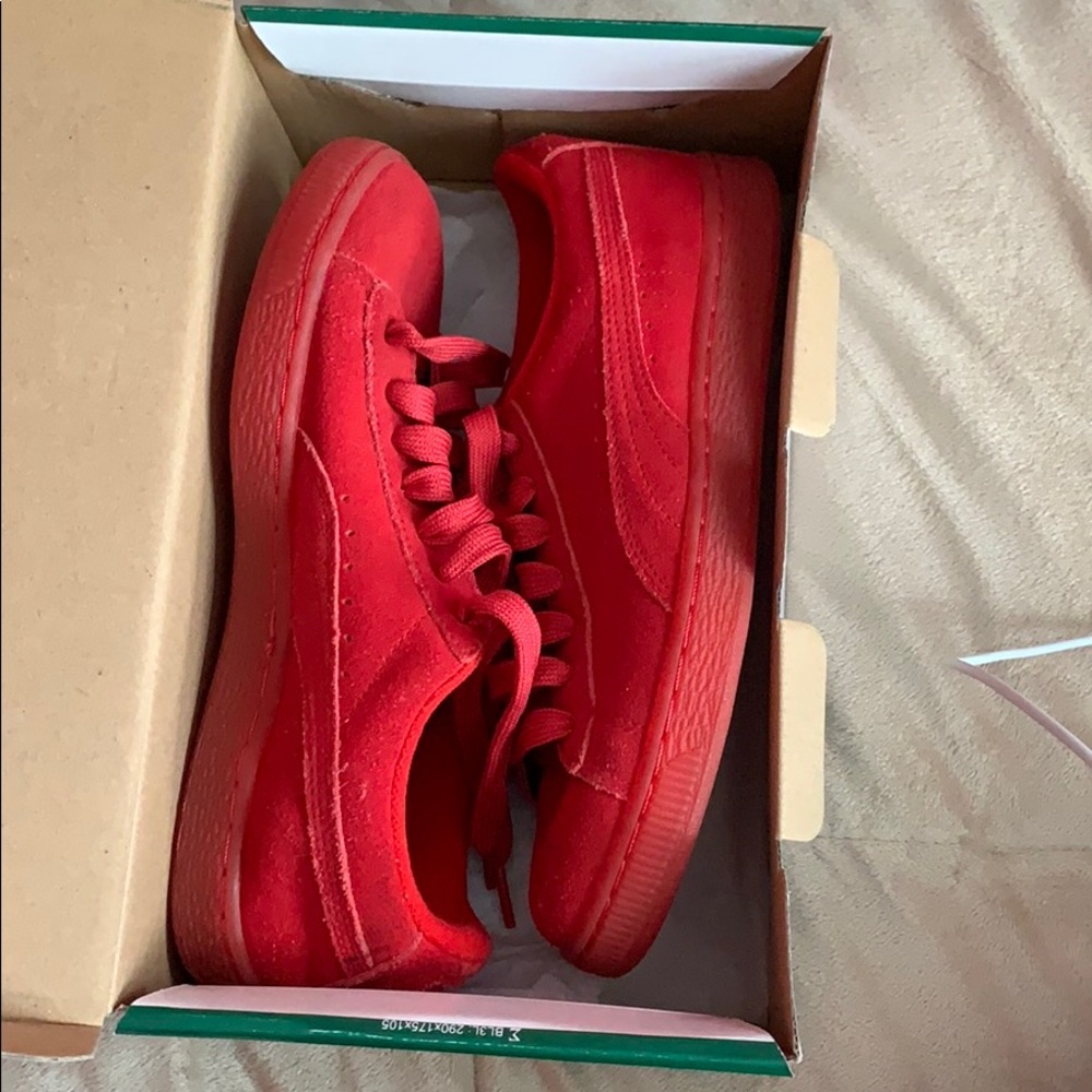 Red suede Pumas